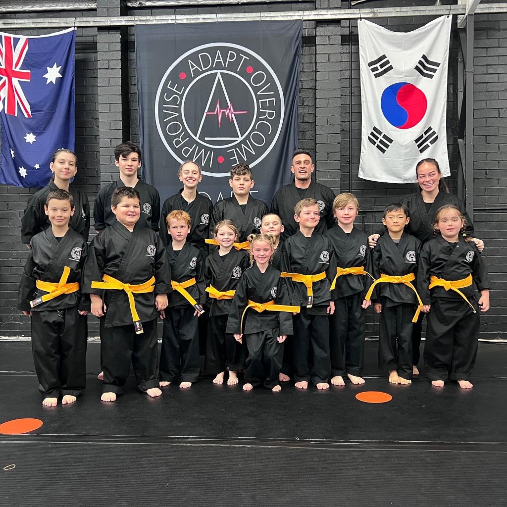 Group of children with yellow belts